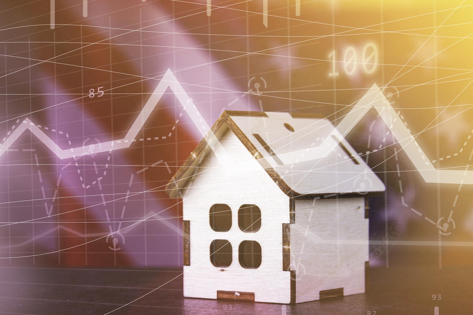 A model of a house sits in front of a translucent financial graph showing rising prices and a faint Canadian flag, symbolizing the causes of Canada's housing crisis.